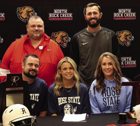 North Rock Creek senior Katie Larson signed last week to play college softball at Rose State. Shown with her in the front row are her parents, Mike and Rachelle Larson. In the back row are NRC assistant coach Mike Cox and head coach Chance Griffin. Photo/Shery Gowin
