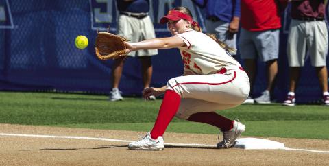 Teague Muncy catches the ball for a first base out. Photo/Rick Hester