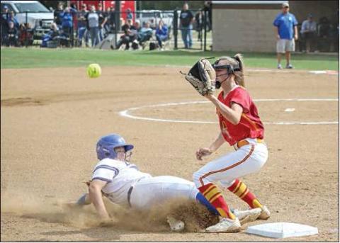 Lady Tiger Emma Davis slides into third while Dale third baseman Danyn Lang waits on the throw. Photo/Rick Hester