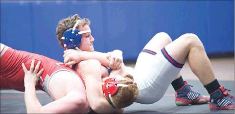 Chandler got several outstanding individual performances against Hinton, including Dalton Fowble, top, at 160 pounds; Chase Massie,