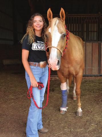 Kenzie Cowden and Peaches, shortly after the horse was injured in late July. Photo/Brian Blansett