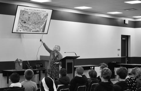 Gifted and Talented teacher Karrie Cheney presents the history of Rt. 66 to students at Park Road before Mayor Kent McVey introduced the Chandler Initiative. Photo/Emily Kalka