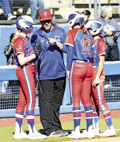Chandler’s Lady Lions rolled into the state semifinals last week before falling to eventual state champion Lone Grove. Above coach Bryan Herring confers with Blaklei Smith, left; Ellie Hilgenfeld, center, and Brenlee Correa during a timeout in the Lady Lions’ 6-0 win over in the first round. Right, Kennedy Allen delivers a pitch during her no-hitter against Lindsay. Below, Blaklei Smith celebrates after a basehit. For more on the state tournament, see Section C. Photos/Brian Blansett
